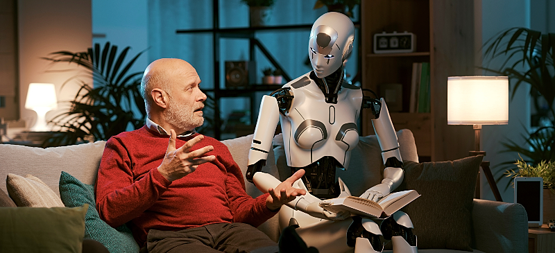 Hombre dialogando con un robot que representa la Inteligencia Artificial Hombre dialogando con un robot que representa la Inteligencia Artificial
